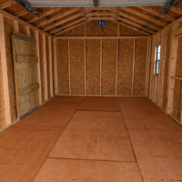 Empty Wooden Garage Interior 12'x20' Economy Ranch Wood Panel Garage