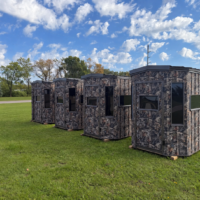 Five Camouflaged Blinds in a Grassy Field (1) 6'x6' Octagon Deer Blind