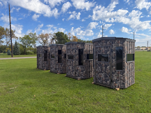 Five Camouflaged Blinds in a Grassy Field (1) 6'x6' Octagon Deer Blind